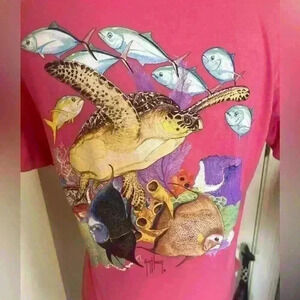 Guy Harvey ladies pink t shirt. Says Large but fits like a medium.
